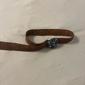 Brown belt with flower buckle